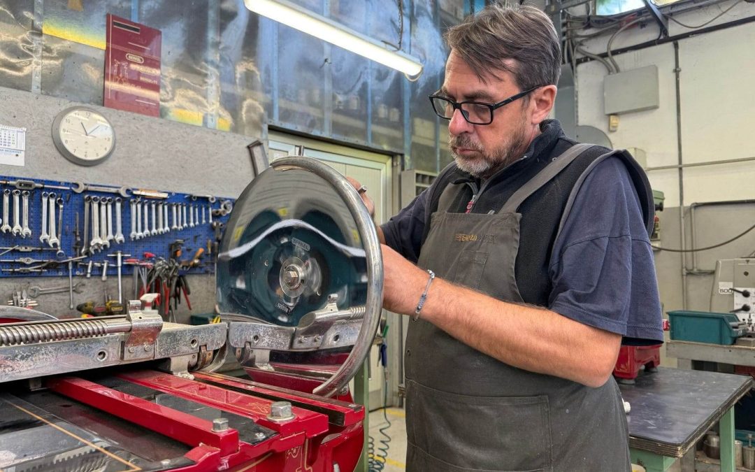 Antonio Barra, a specialist in vintage Berkel slicer restoration, working on an antique Berkel slicer and preserving its original components.